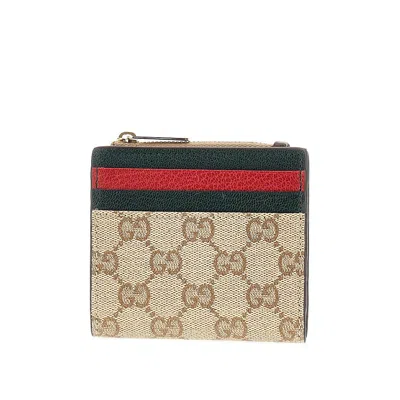 Gucci Coated Gg Fabric Bi-fold Wallet In Brown