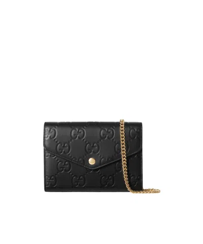 Gucci Debossed G Monogram Crossbody Bag In Black