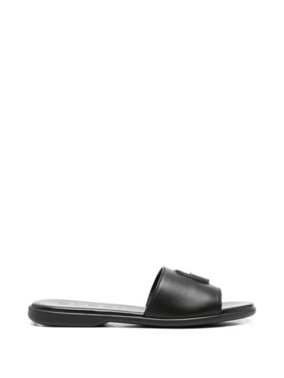 Gucci Calfskin Leather Slides With Embossed Gg Monogram In Black
