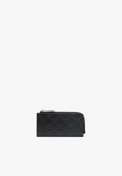 Gucci Emblem Zipped Wallet In Black