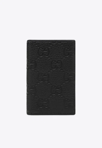 Gucci Embossed Gg Leather Wallet In Black