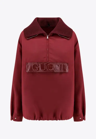 GUCCI EMBOSSED LOGO HALF-ZIP JACKET