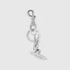Gucci Engraved Surfer Keychain Charm In Metallic