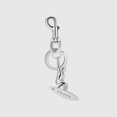 Gucci Engraved Surfer Keychain Charm In Metallic