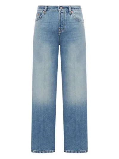 Gucci Blue Jeans With Logo Patch On The Rear And Faded Effect In Denim Woman