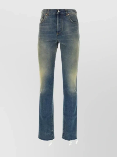GUCCI FADED DISTRESSED DENIM TROUSERS WITH EMBROIDERED BACK POCKET