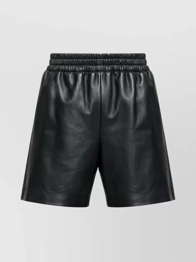 GUCCI FAUX LEATHER SHORTS FEATURING ELASTIC WAISTBAND