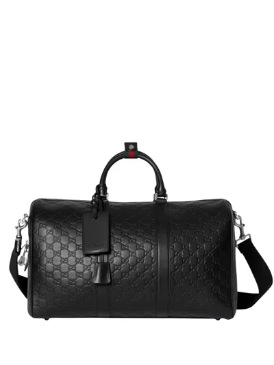Gucci Gg Emblem Leather Duffle Bag With Embossed Gg Monogram In Black