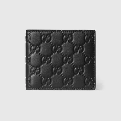 Gucci Men Gg Emblem Leather Wallet With Embossed Gg Logo In Black