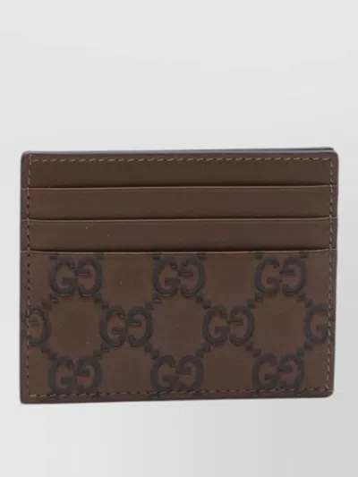 Gucci Gg Emblem Leather Compact Card Holder In Brown