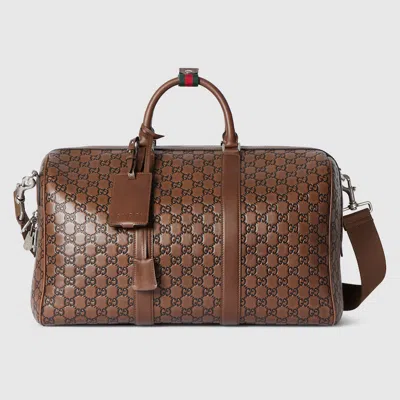 Gucci Gg Emblem Medium Duffle Bag In Brown
