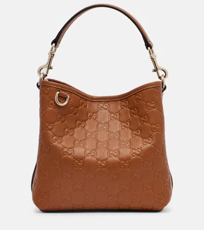 Gucci Gg Emblem Small Leather Bucket Bag In Brown