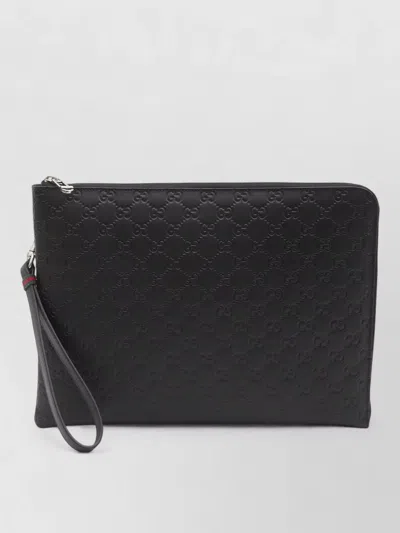 Gucci Gg Emblem Wrist Strap Leather Clutch In Black