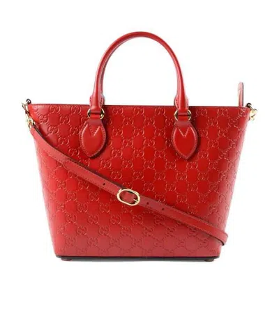 Gucci Gg Embossed Handbag In Red