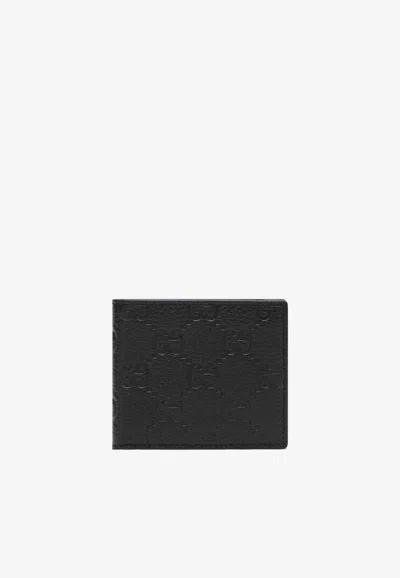 Gucci Gg Embossed Leather Bi-fold Wallet In Black