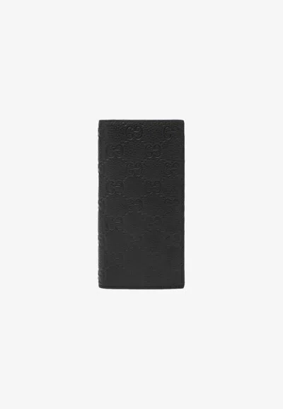 Gucci Gg Embossed Long Leather Wallet In Black