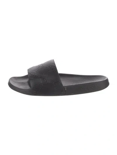 Pre-owned Gucci Gg Embossed Rubber Slides In Black