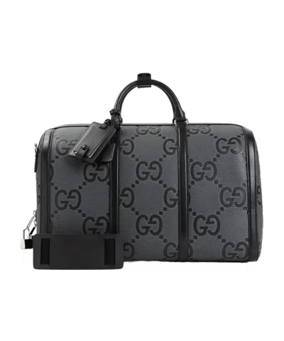 Gucci Gg Embossed Travel Bag In Black
