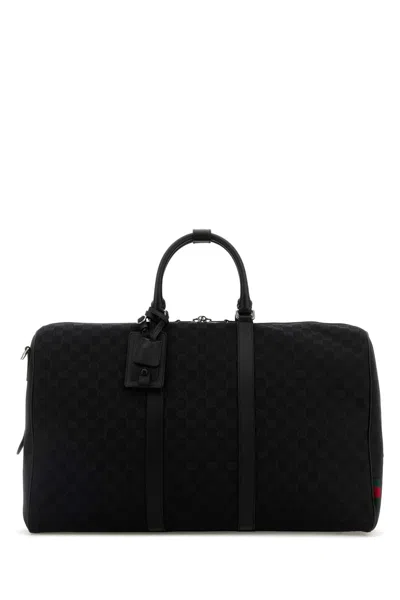 Gucci Travel Bag With Embossed Design And Tag In Black