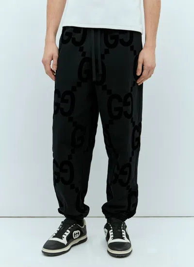 Gucci Gg Flocked Print Cotton-fleece Track Pants In Black
