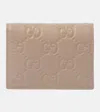 Gucci Gg Mini Debossed Leather Wallet In Beige