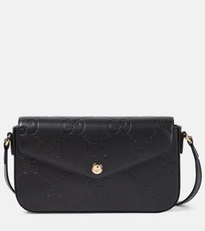 Gucci Gg Mini Leather Crossbody Bag In Black