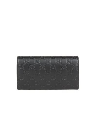 Gucci Gg Signature Embossed Calf Leather Wallet In Black