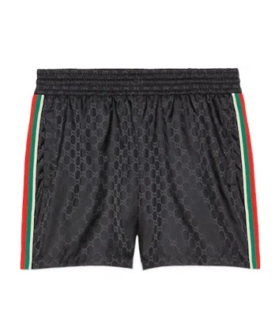 GUCCI GUCCI MONOGRAMMED DRAWSTRING SWIM TRUNKS