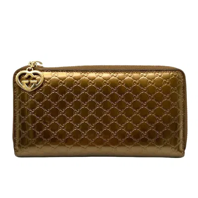 Gucci Gold Patent Leather Wallet  ()