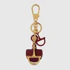 Gucci Half-horsebit Shaped Keychain In Burgundy
