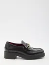 Gucci Logo-chain Leather Loafers In Black