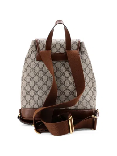 Pre-owned Gucci Interlocking G Patch Drawstring Flap Gg Coated Canvas Small Backpack In Brown