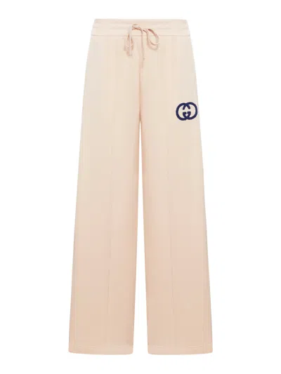 Gucci Gg Embroidered Cotton Jersey Sweatpants In Pink