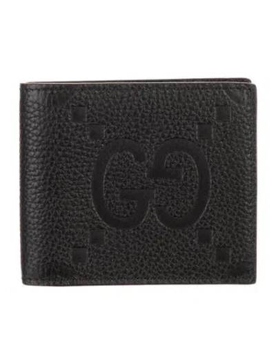 Pre-owned Gucci Jumbo Gg Embossed Leather Bifold Wallet In Black