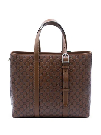 Gucci Grosse Tote Bag Aus Leder Mit Gg-prägung In Brown
