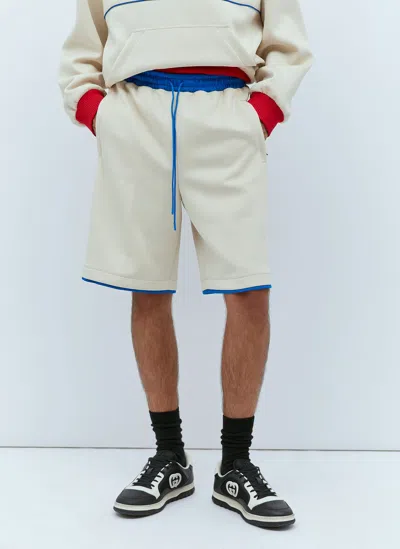 Gucci Logo Embossed Basket Shorts In Beige