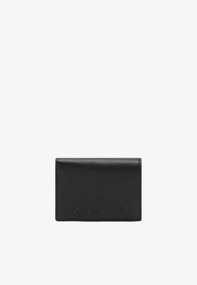 Gucci Logo Embossed Leather Wallet In Black