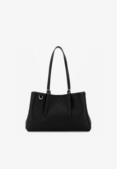 Gucci Medium Gg Embossed Leather Shoulder Bag In Black