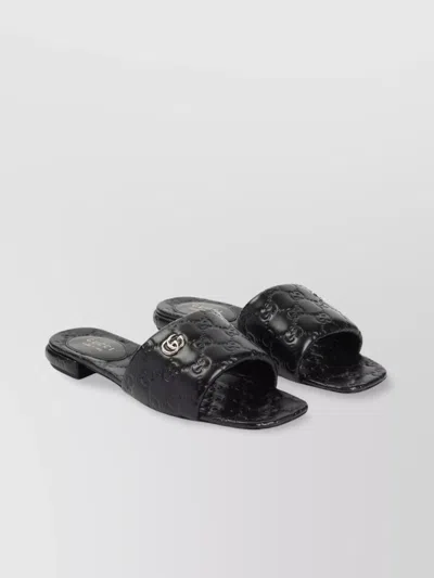 Gucci Meg Flat Sandals With Engraved Signature Gg Logo In Black