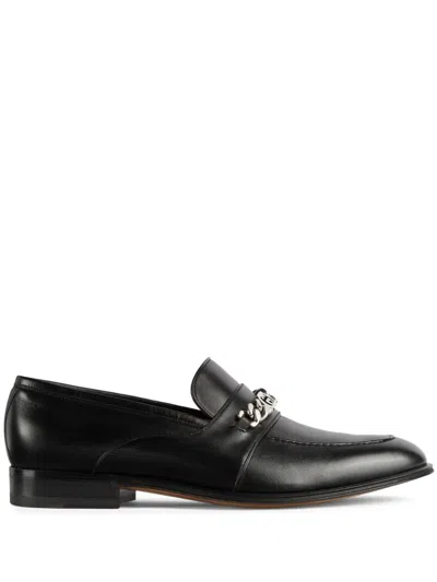 GUCCI MEN'S BLACK LEATHER LOAFERS WITH CHAIN DETAILING AND LOGO PLAQUE