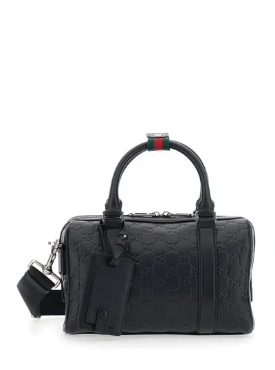 Gucci Men 'emblem' Black Handbag With All-over Embossed Gg Motif And Web Detail In Leather Man