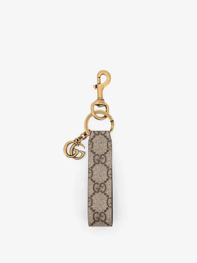 Gucci Men Gg Supreme Fabric Keyring In Gold
