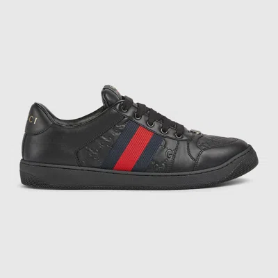Gucci Gg Embossed Leather Low-top Sneakers In Black