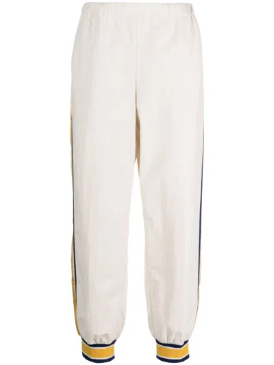 GUCCI MEN'S STRIPED ELASTIC TRACK PANTS IN WHITE FOR FW23