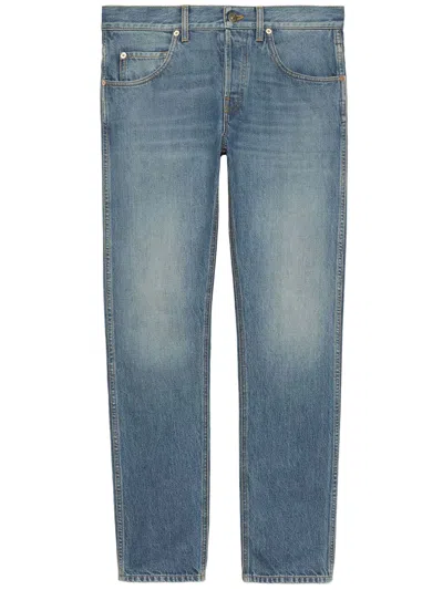 Gucci Men's Washed Light Blue Denim Jeans With Embossed Leather Label