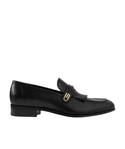 GUCCI GUCCI LOGO DETAILED SLIP-ON LOAFERS