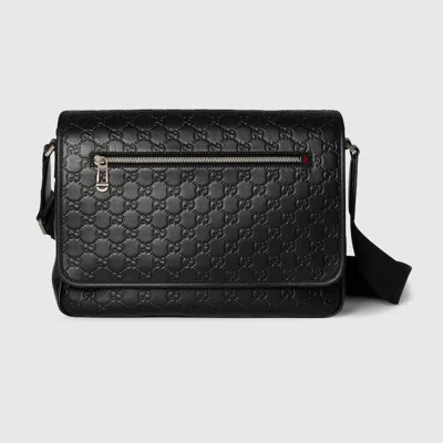 Gucci Medium Gg Emblem Embossed Messenger Bag In Black