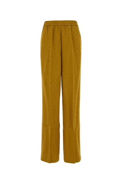 Gucci Jacquard Viscose-acetate Joggers In Gold