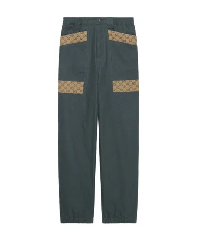 Gucci Panelled Monogram-pattern Trousers In Gray