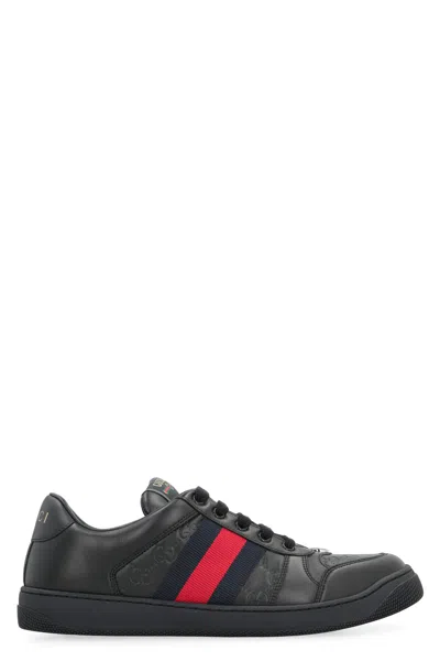 Gucci Gg Embossed Leather Low-top Sneakers In Black